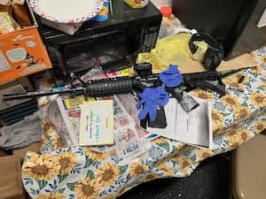 A recovered rifle lies on a table, after a white man armed with a high-powered rifle and a handgun killed three Black people before shooting himself at a Dollar General store, in what local law enforcement described as a racially motivated crime in Jacksonville, Florida, U.S., August 26, 2023.  Jacksonville Sheriff’s Office/Handout via REUTERS    THIS IMAGE HAS BEEN SUPPLIED BY A THIRD PARTY.