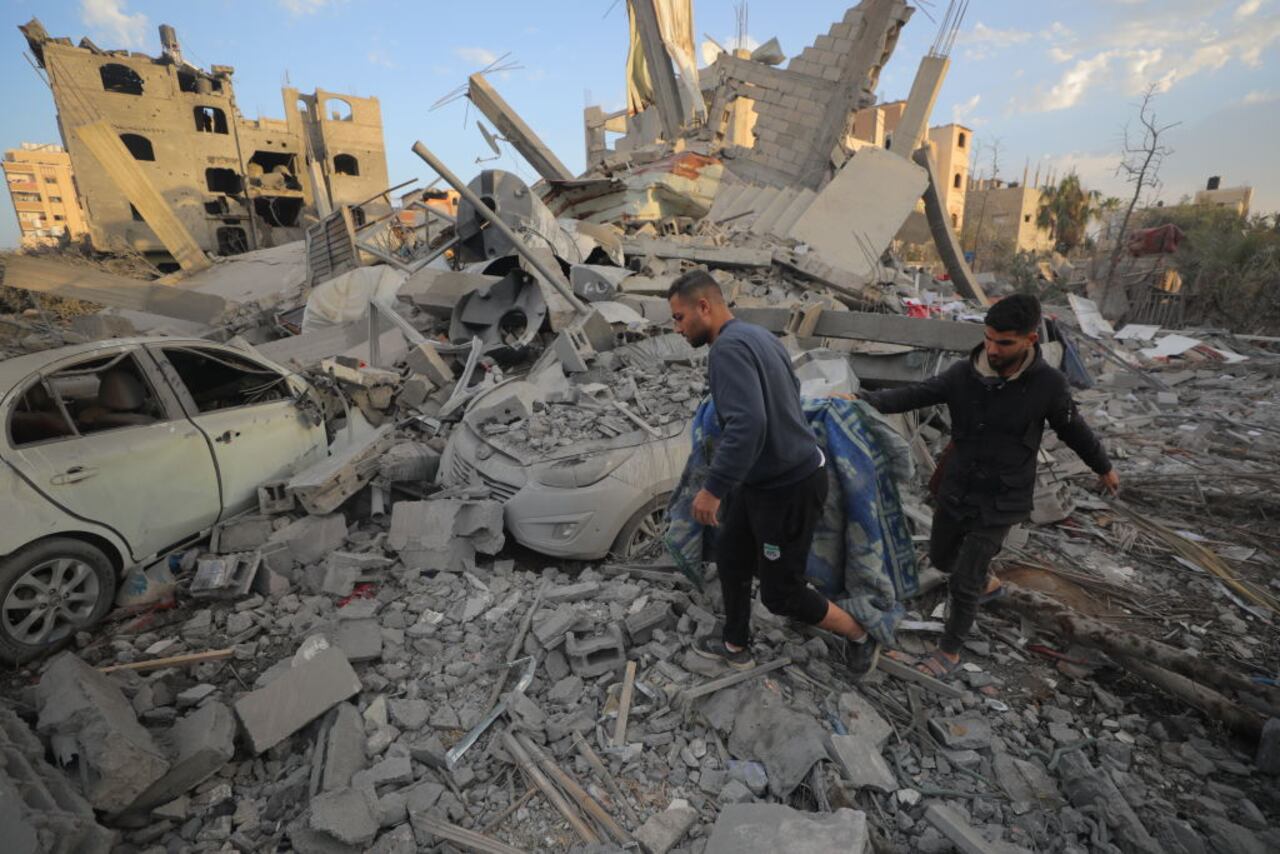 DEIR AL-BALAH, GAZA - MARCH 18: After an Israeli airstrike hit the home of the Abu Mershud family in the Nuseirat Refugee Camp, five kilometers north-east of Deir al-Balah in central Gaza, killing seven members of the family, Palestinians gather usable items from the debris on March 18, 2025. The Gaza local authorities on Tuesday morning said that over 322 Palestinians were killed and missing in a matter of five hours across the Gaza Strip as Israel resumed its attacks, breaking the ceasefire that lasted nearly two months. (Photo by Hassan Jedi/Anadolu via Getty Images)