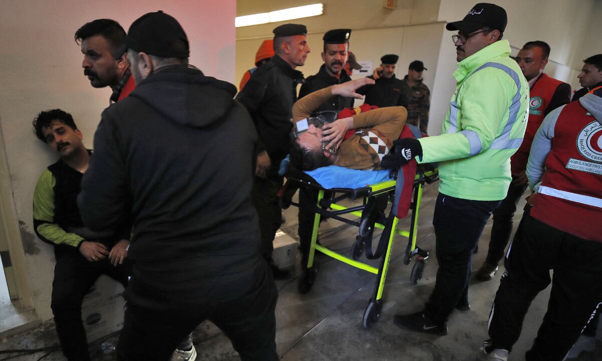 Injured football spectators are brought into an emergency area at the Basra International Stadium following a stampede ahead of this evening's final match of the Arabian Gulf Cup between Iraq and Oman, on January 19, 2023 in Basra. One person was killed and dozens injured when a stampede broke out outside the football stadium in southern Iraq hours before the Gulf Cup final, medical and security sources said.
AFP/AHMAD AL-RUBAYE