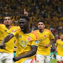 Colombia's Daniel Munoz (2) celebrates with his teammates Davinson Sanchez (23) and Luis Diaz (7) after scoring his side's opening goal during the World Cup Group K soccer match between Colombia and Congo in Zapopan, near Guadalajara, Mexico, Tuesday, June 23, 2026. (AP Photo/Fernando Llano)
