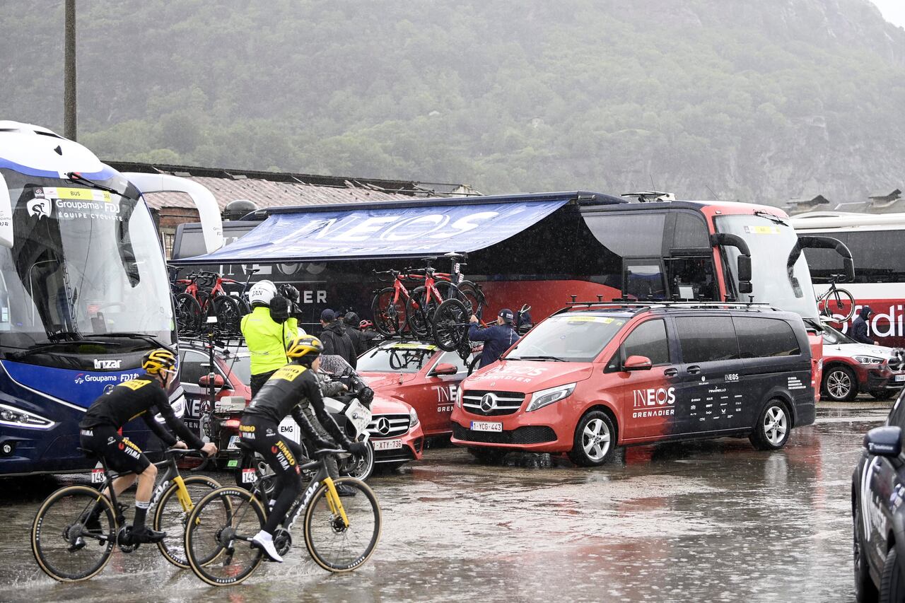 Cyclists' bicycles are loaded onto vehicles after the first section of stage 13 of the Giro d'Italia cycling race, from Borgofranco d'Ivrea to Crans Montana, Switzerland, was canceled due to bad weather conditions, in Borgofranco d'Ivrea, Italy, Friday, May 19, 2023. (Fabio Ferrari/LaPresse via AP)