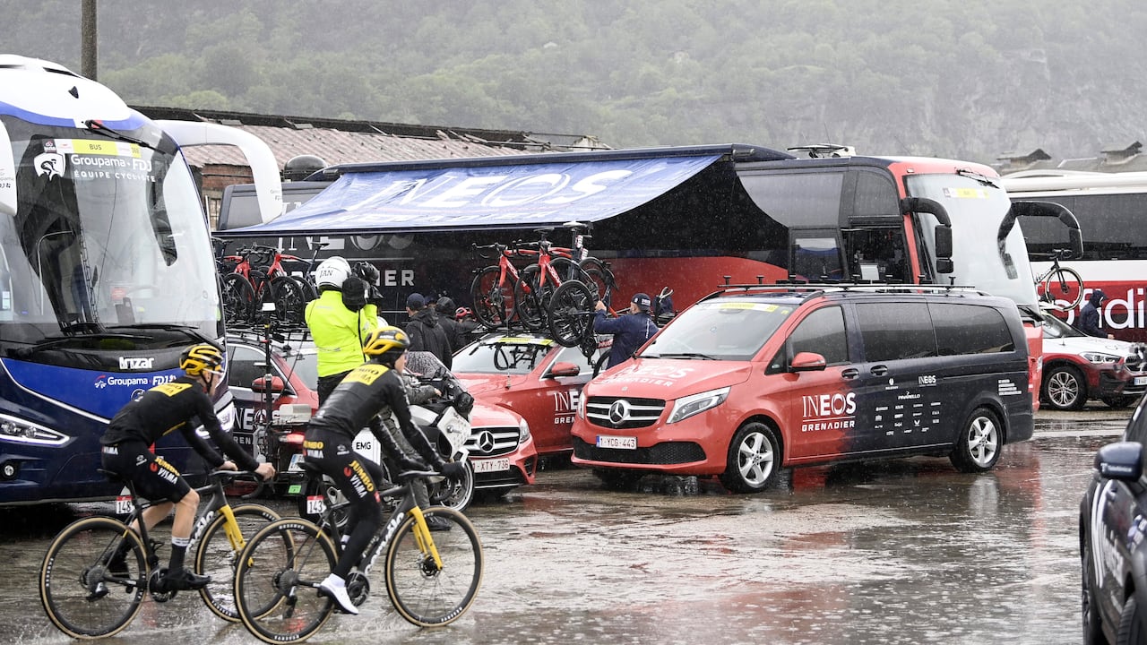 Cyclists' bicycles are loaded onto vehicles after the first section of stage 13 of the Giro d'Italia cycling race, from Borgofranco d'Ivrea to Crans Montana, Switzerland, was canceled due to bad weather conditions, in Borgofranco d'Ivrea, Italy, Friday, May 19, 2023. (Fabio Ferrari/LaPresse via AP)