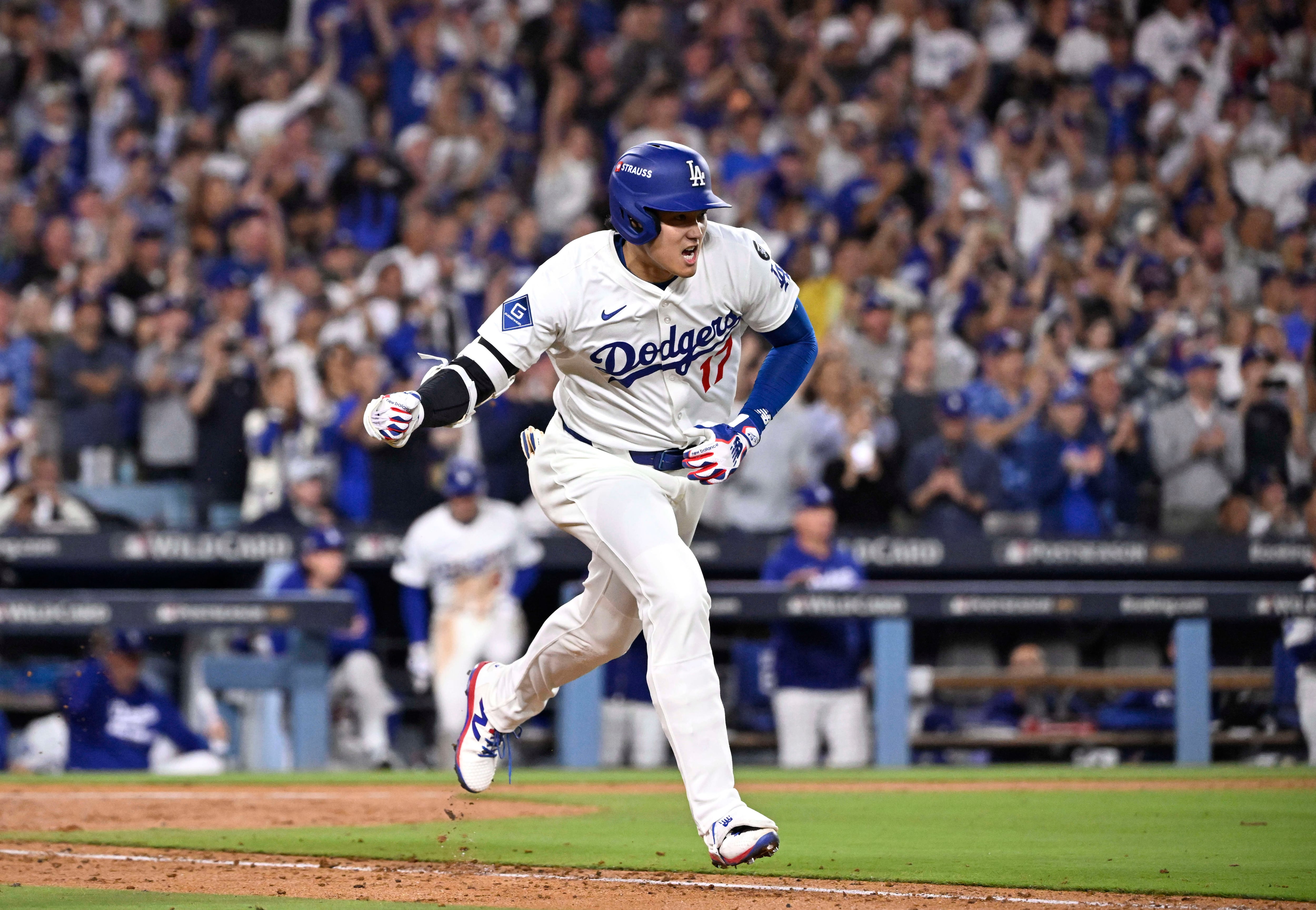 Los Angeles, CA - October 01: Shohei Ohtani #17 of the Los Angeles Dodgers reacts after hitting a RBI single as teammate Kiki Hernandez (not pictured) scores against the Cincinnati Reds in the sixth inning of game 2 of a National League wild card series baseball game at Dodger Stadium in Los Angeles on Wednesday, October 1, 2025. (Photo by Keith Birmingham/MediaNews Group/Pasadena Star-News via Getty Images)