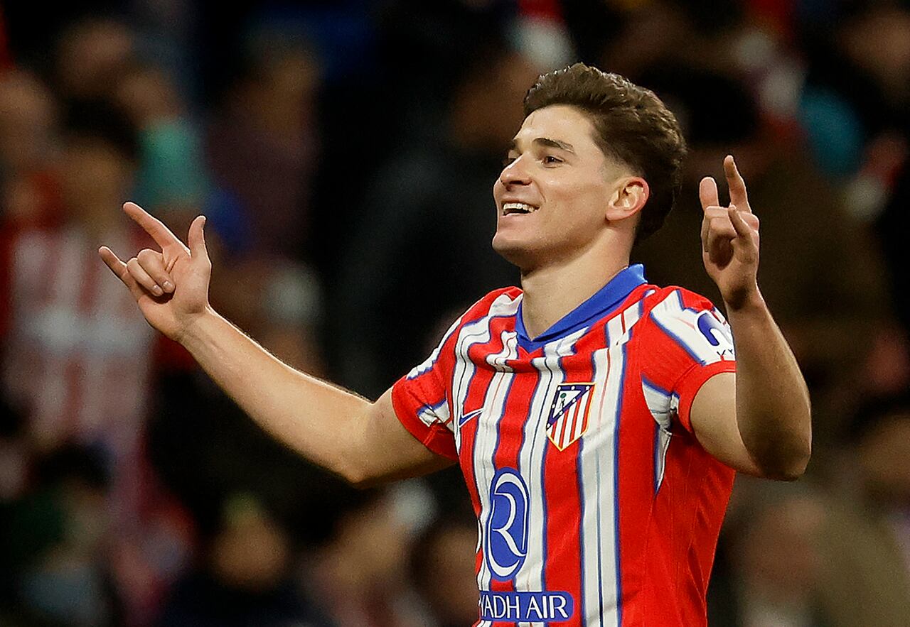 Atletico Madrid's Argentine forward #19 Julian Alvarez celebrates scoring the opening goal during the UEFA Champions League, league phase football match between Club Atletico de Madrid and Slovan Bratislava at the Metropolitano stadium in Madrid on December 11, 2024. (Photo by Pierre-Philippe MARCOU / AFP)