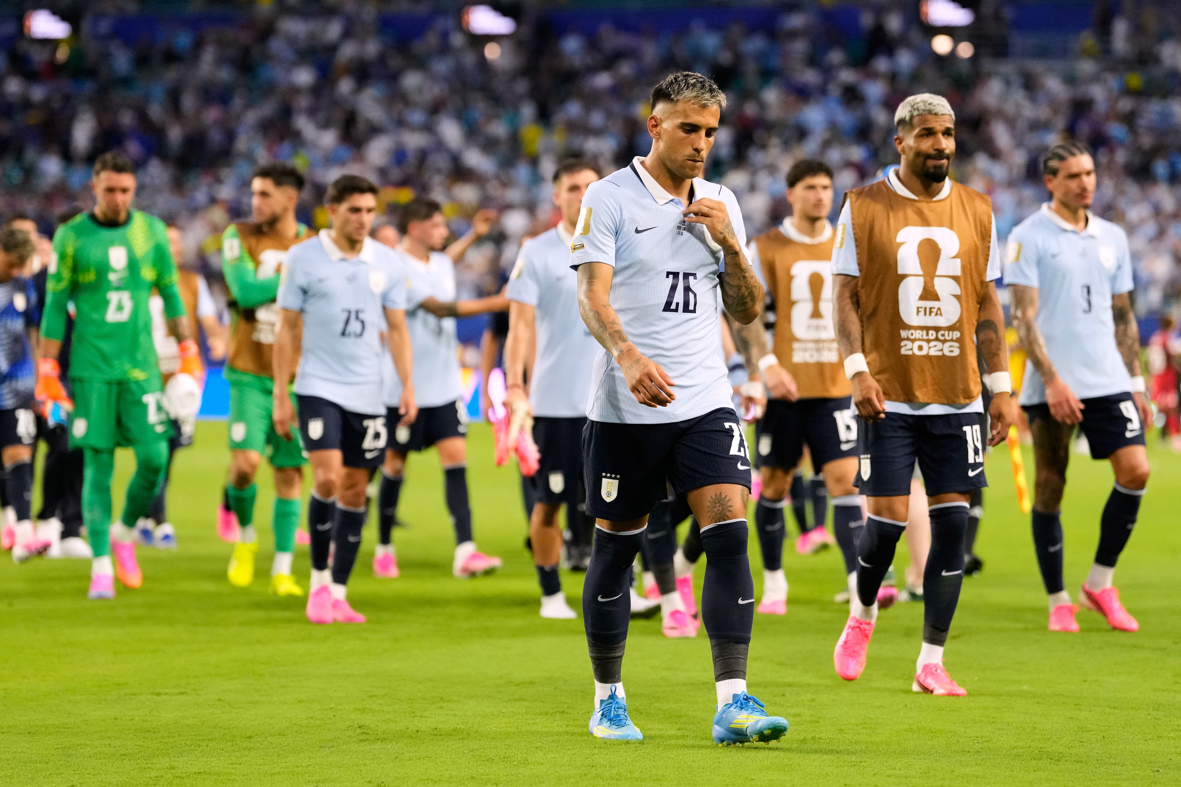 Uruguay players walk from the field following the World Cup Group H soccer match between Uruguay and Cape Verde in Miami Gardens, Fla., Sunday, June 21, 2026. (AP Photo/Rebecca Blackwell)