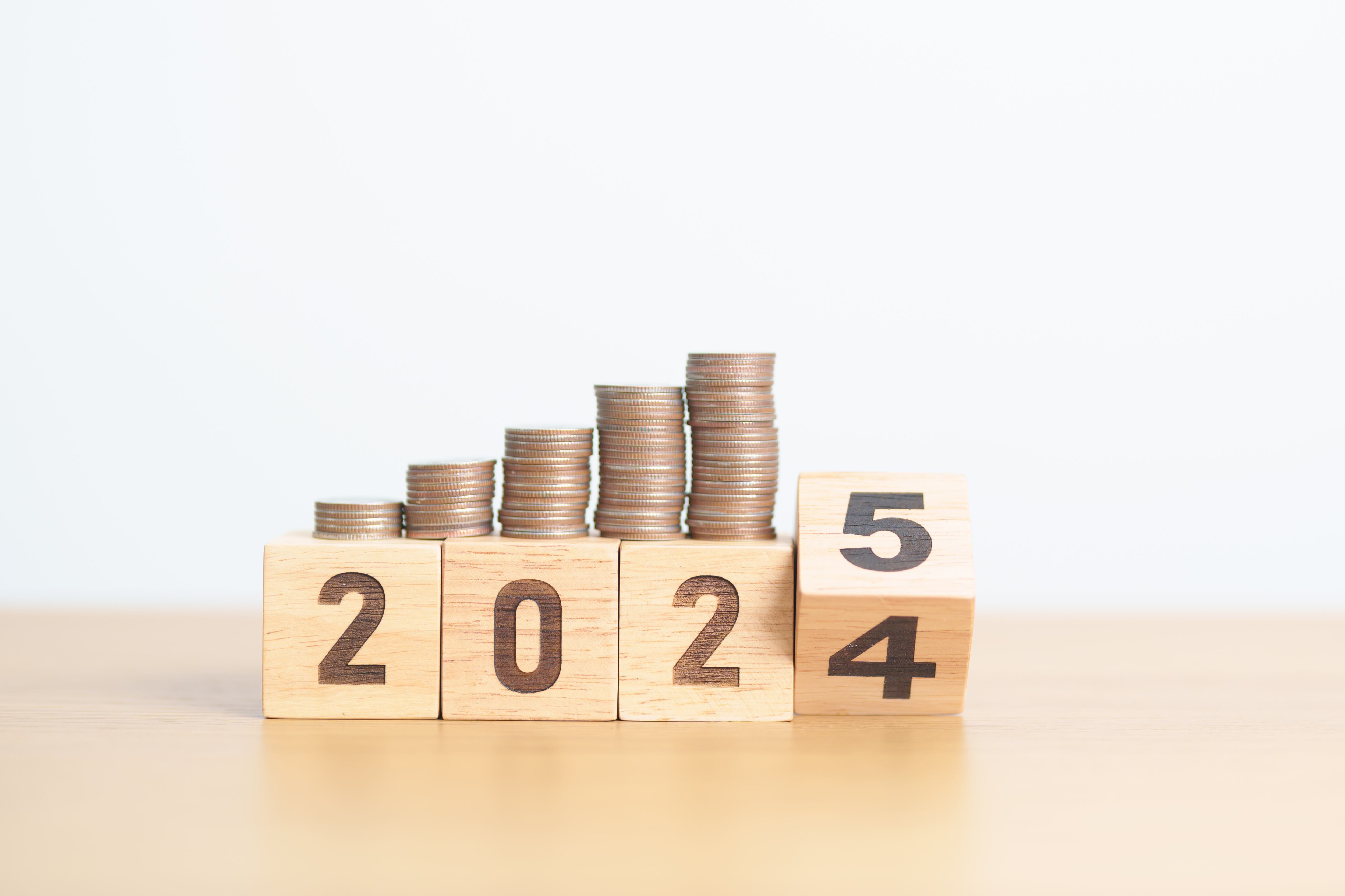 2024 end year to Happy New Year 2025 with Coins stack. Money, Budget, tax, investment, financial, savings and New Year Resolution concepts