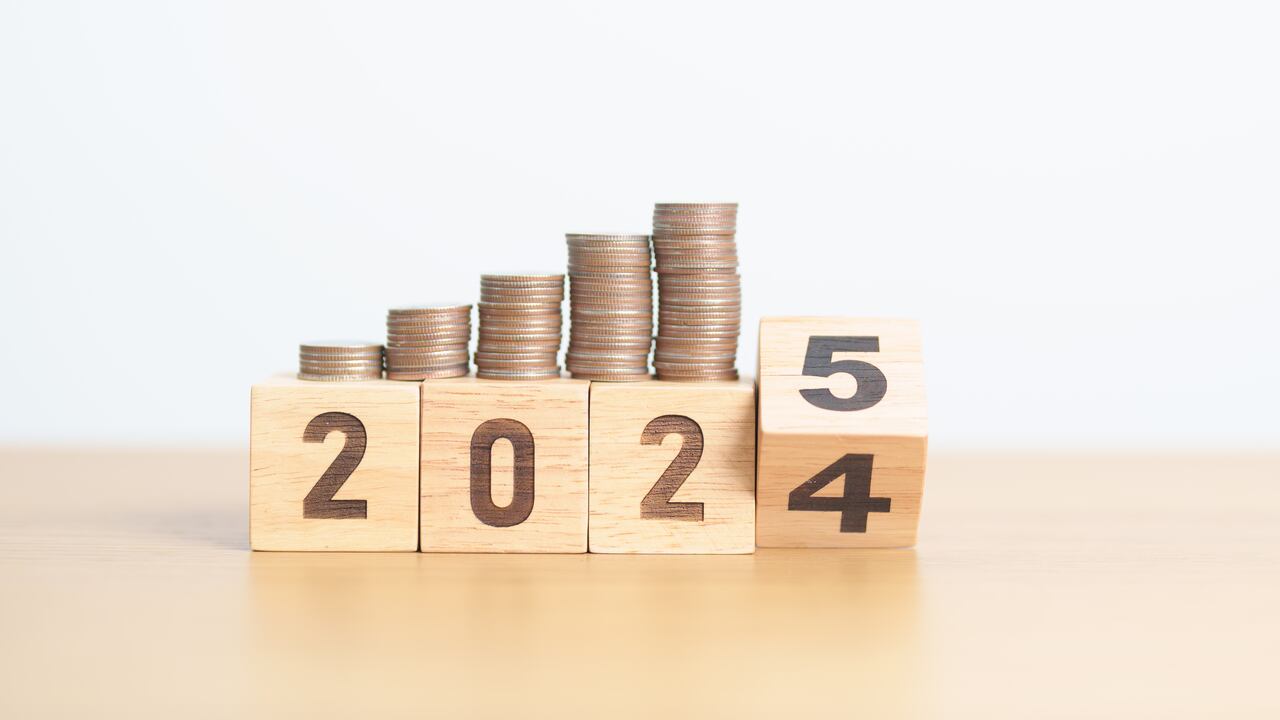 2024 end year to Happy New Year 2025 with Coins stack. Money, Budget, tax, investment, financial, savings and New Year Resolution concepts