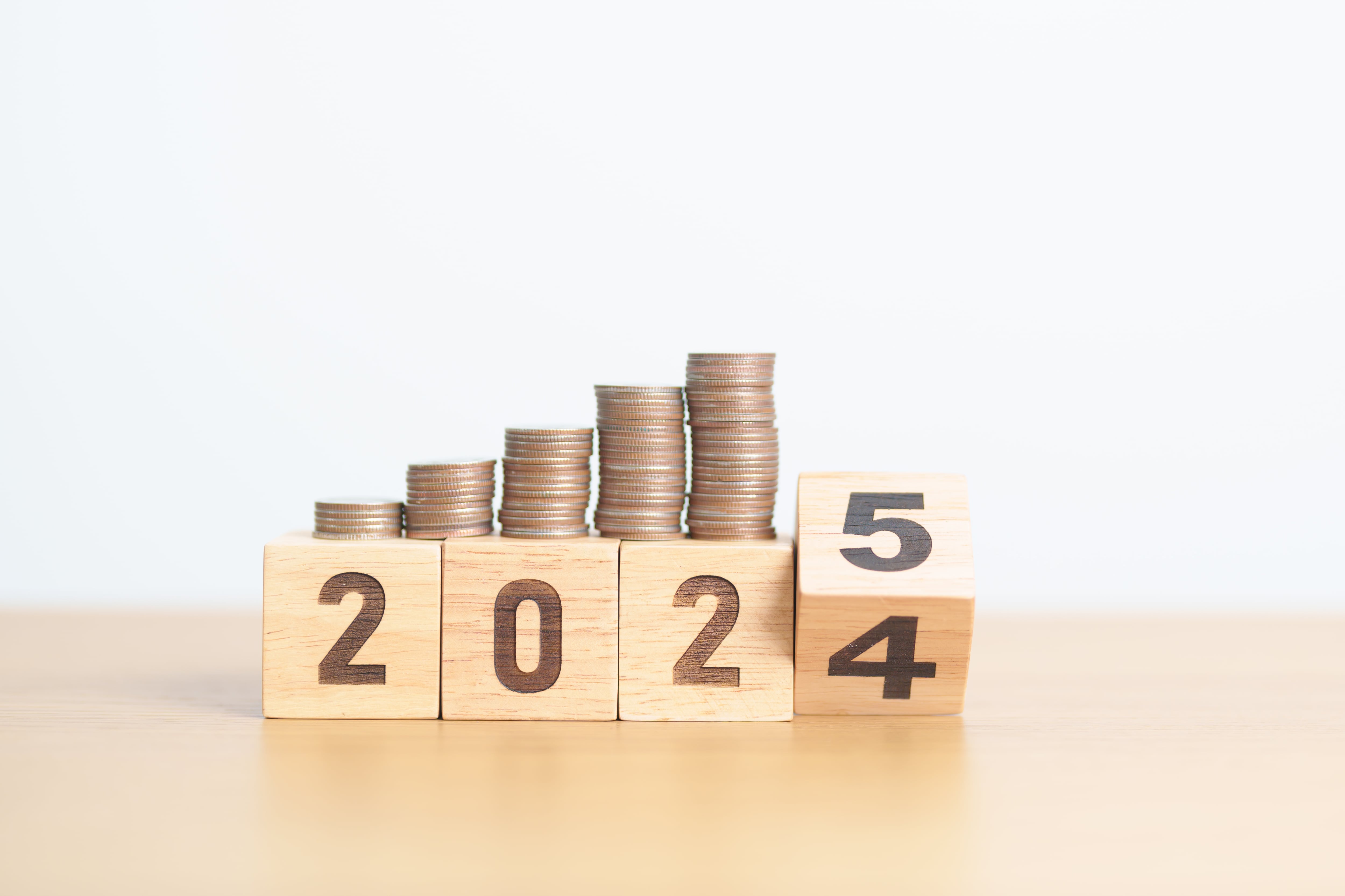 2024 end year to Happy New Year 2025 with Coins stack. Money, Budget, tax, investment, financial, savings and New Year Resolution concepts