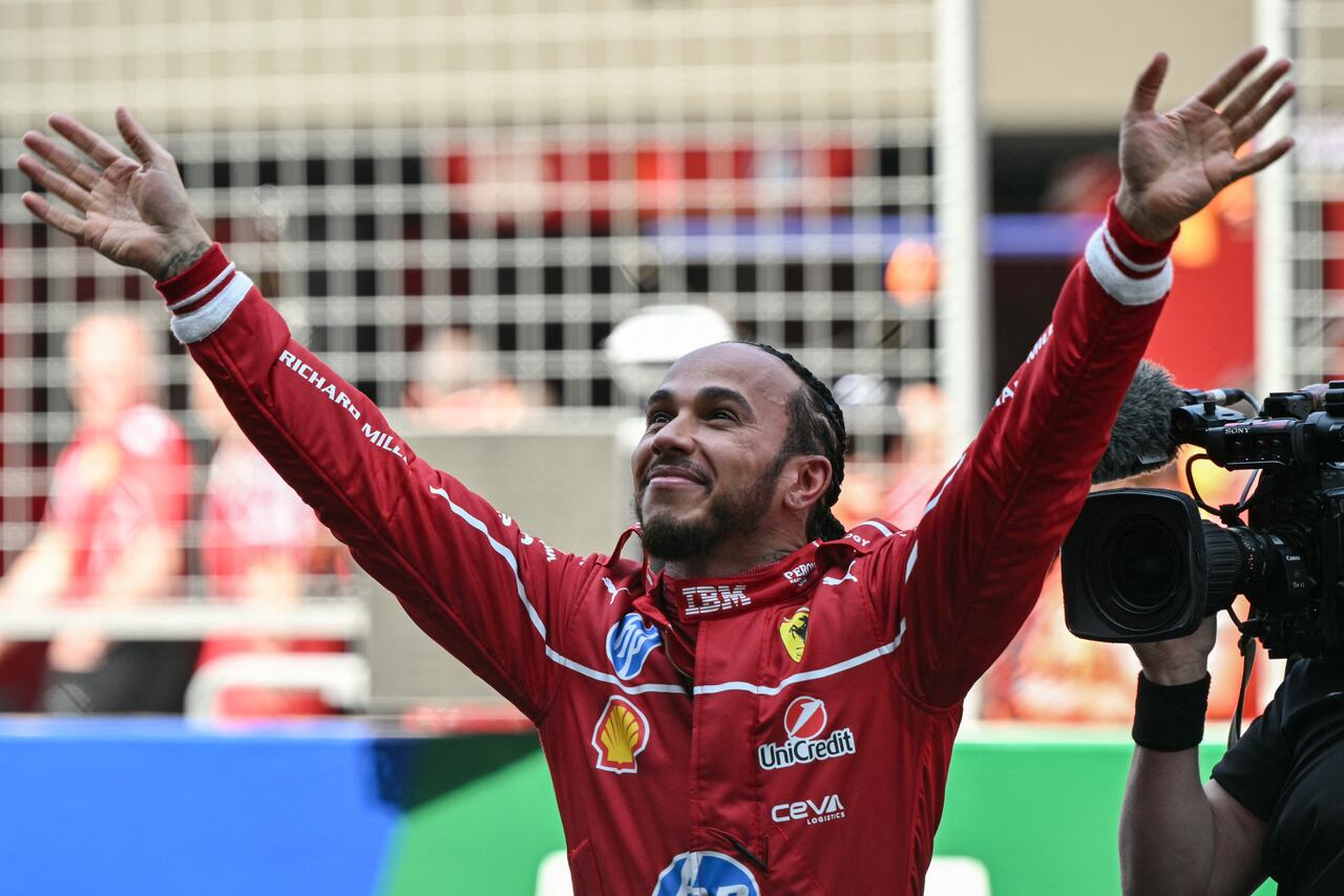 Ferrari's British driver Lewis Hamilton celebrates winning the sprint race of the Formula One Chinese Grand Prix at the Shanghai International Circuit in Shanghai on March 22, 2025. (Photo by Greg Baker / AFP)