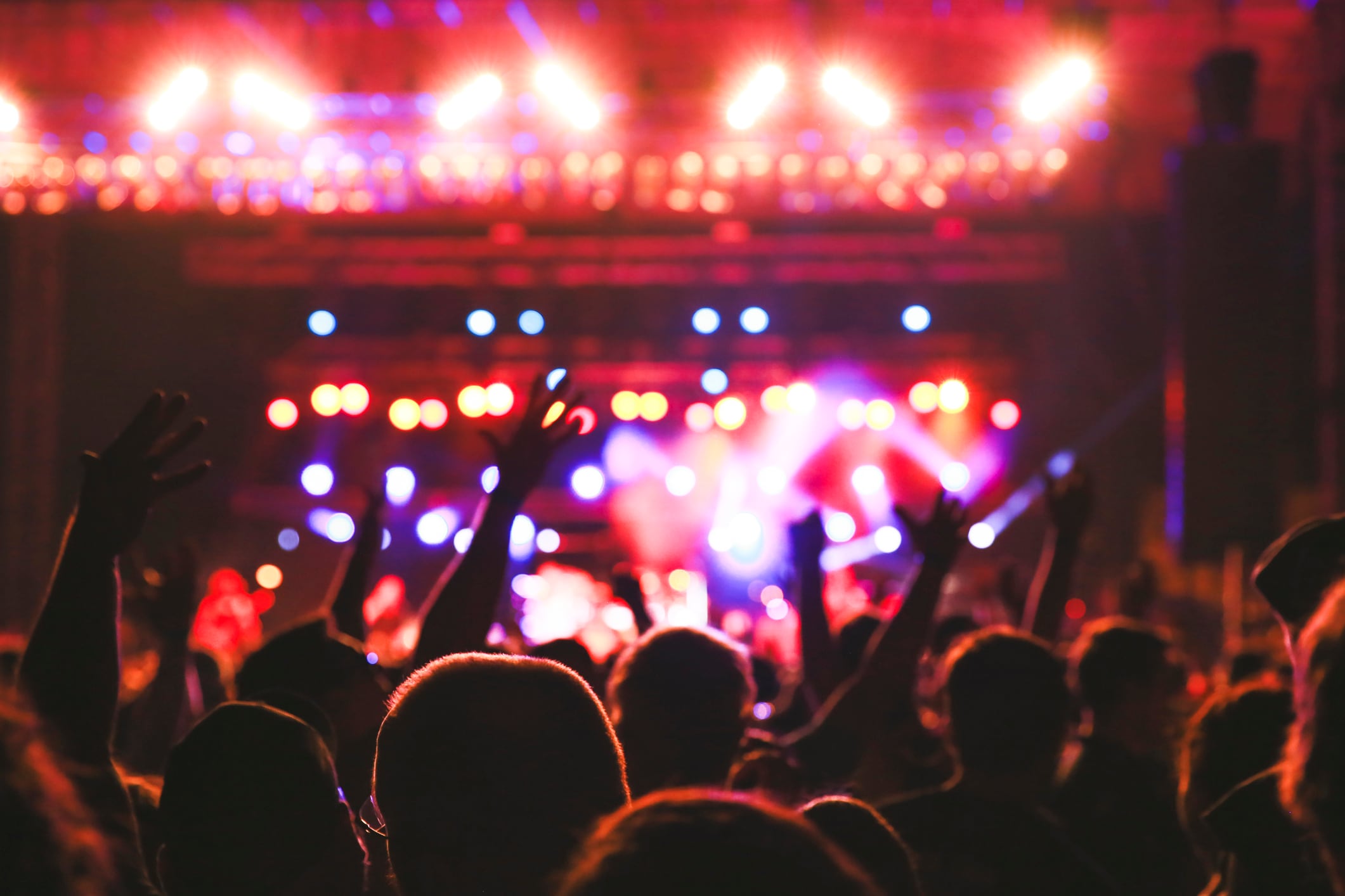 Friends hanging out at big music festival