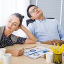 Coffee break time Business and team sleeping at in conference room during meeting office desk. Young businessman with eyeglasses overworked and fell asleep Creative casual man sleeping at his working place