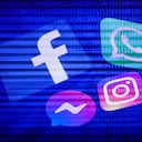 Facebook, WhatsApp, Messenger, Instagram logos displayed on a phone screens and binary code displayed on a laptop screen are seen in this multiple exposure illustration photo taken in Poland on October 10, 2021. (Photo by Jakub Porzycki/NurPhoto via Getty Images)