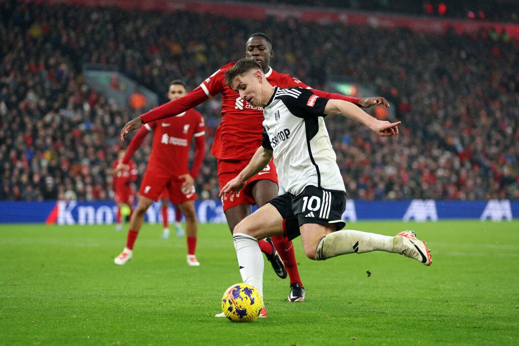 LIVERPOOL, ENGLAND - DECEMBER 03: Tom Cairney of Fulham whilst under pressure from Ibrahima Konate of Liverpool during the Premier League match between Liverpool FC and Fulham FC at Anfield on December 03, 2023 in Liverpool, England. (Photo by Clive Brunskill/Getty Images)