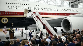 US President Donald Trump walks past the new Air Force One, gifted to him by Qatar, in a hangar at Joint Base Andrews in Maryland on June 19, 2026. White House officials bade farewell on June 18, 2026 to one of the two jets that have been used to transport US presidents for more than 30 years. The goodbye messages fueled speculation that a Boeing 747 controversially gifted to President Donald Trump by the Gulf emirate of Qatar is now due to enter service. Trump will be heading to Joint Base Andrews before spending the weekend at Camp David. (Photo by Brendan SMIALOWSKI / AFP)