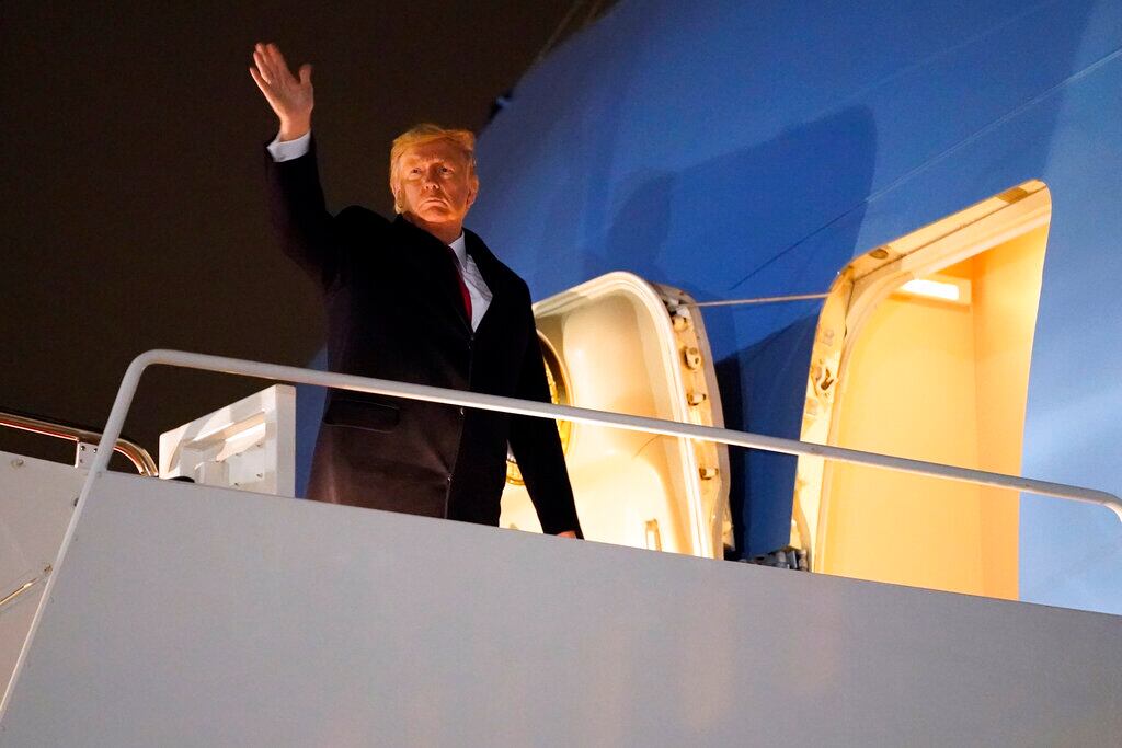 President Donald Trump boards Air Force One to attend a campaign rally for Sen. Kelly Loeffler, R-Ga., and Sen. David Perdue, R-Ga., in Dalton, Ga., Monday, Jan. 4, 2021, at Andrews Air Force Base, Md. (AP Photo/Evan Vucci)