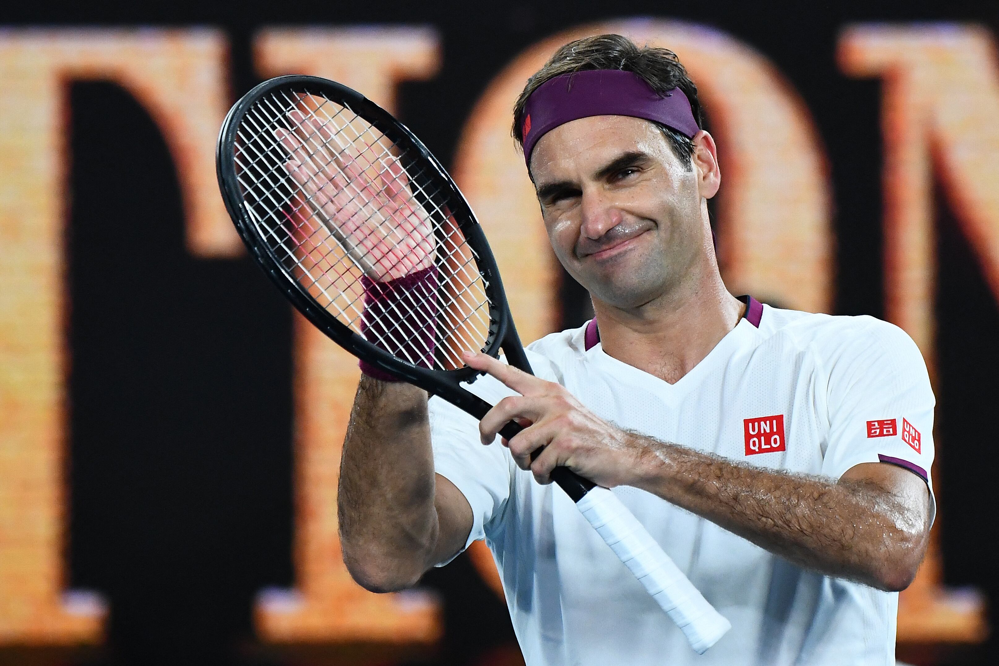 (FILES) In this file photo taken on January 26, 2020 Switzerland's Roger Federer celebrates after victory against Hungary's Marton Fucsovics during their men's singles match on day seven of the Australian Open tennis tournament in Melbourne. - Roger Federer announces his retirement in a statement on September 15, 2022. (Photo by William WEST / AFP) / IMAGE RESTRICTED TO EDITORIAL USE - STRICTLY NO COMMERCIAL USE