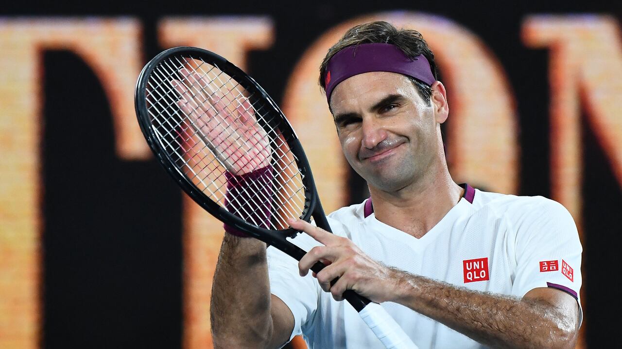 (FILES) In this file photo taken on January 26, 2020 Switzerland's Roger Federer celebrates after victory against Hungary's Marton Fucsovics during their men's singles match on day seven of the Australian Open tennis tournament in Melbourne. - Roger Federer announces his retirement in a statement on September 15, 2022. (Photo by William WEST / AFP) / IMAGE RESTRICTED TO EDITORIAL USE - STRICTLY NO COMMERCIAL USE