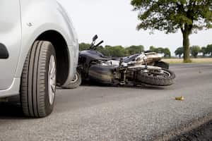 Motorbike Accident on the road with a car