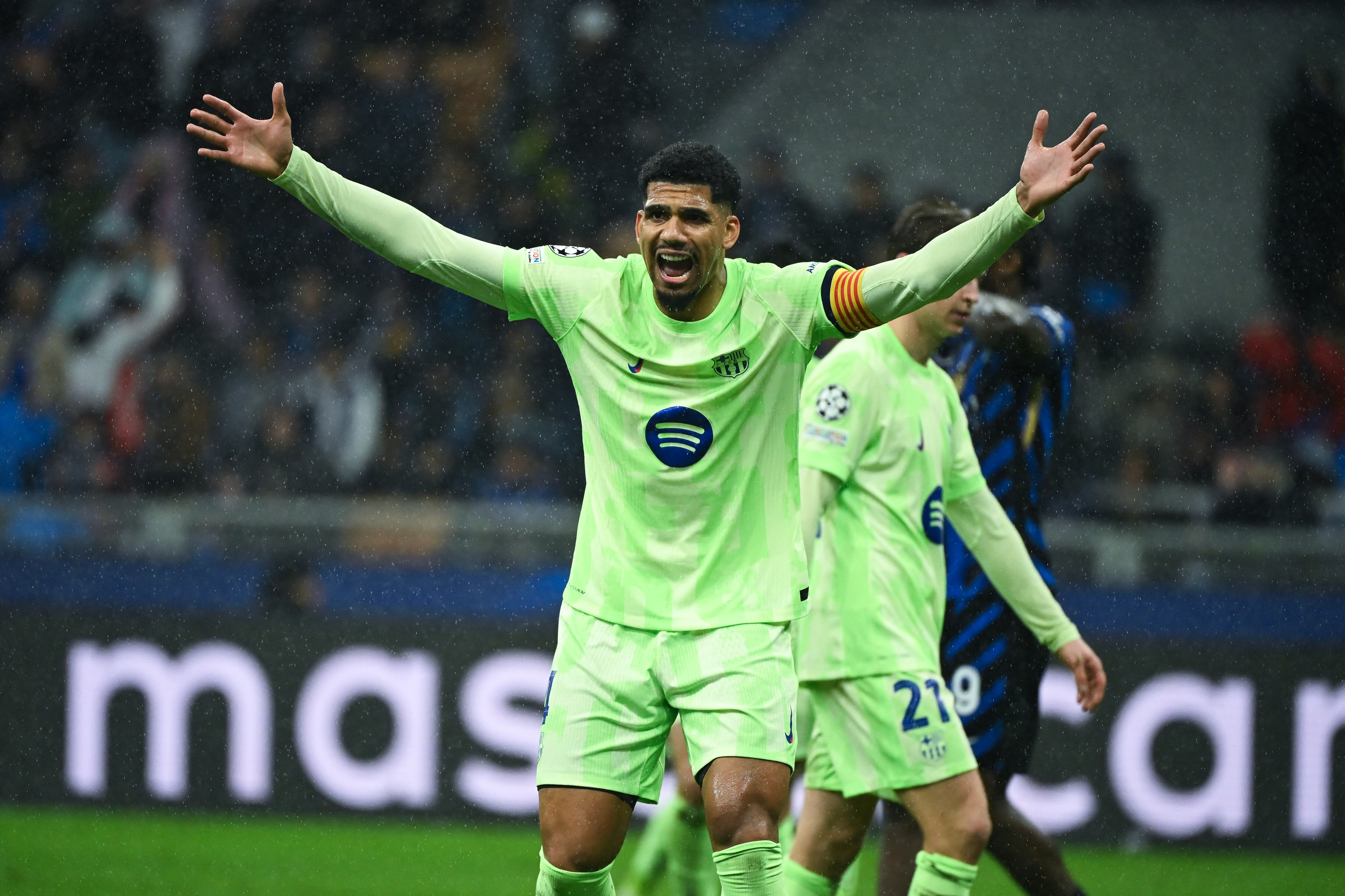 Barcelona's Uruguayan defender #04 Ronald Federico Araujo da Silva reacts during the UEFA Champions League semi-final second leg football match between Inter Milan and FC Barcelona at the San Siro stadium in Milan on May 6, 2025. (Photo by PIERO CRUCIATTI / AFP)