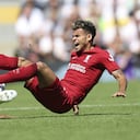 Liverpool's Luis Diaz, right, is tackled by Fulham's Kenny Tete vie for the ball during the English Premier League soccer match between Fulham and Liverpool at Craven Cottage stadium in London, Saturday, Aug. 6, 2022. (AP Photo/Ian Walton)