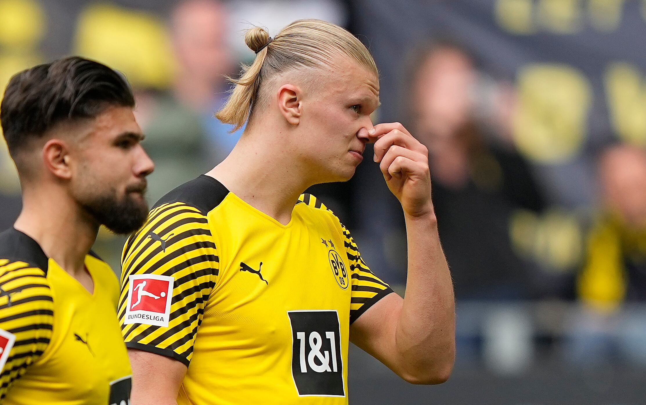 Dortmund's Erling Haaland, right, reacts disappointed in front of their supporters after losing the German Bundesliga soccer match between Borussia Dortmund and VfL Bochum in Dortmund, Germany, Saturday, April 30, 2022. (AP Photo/Martin Meissner)