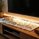 Estas son las funciones de colocar papel aluminio debajo del televisor.