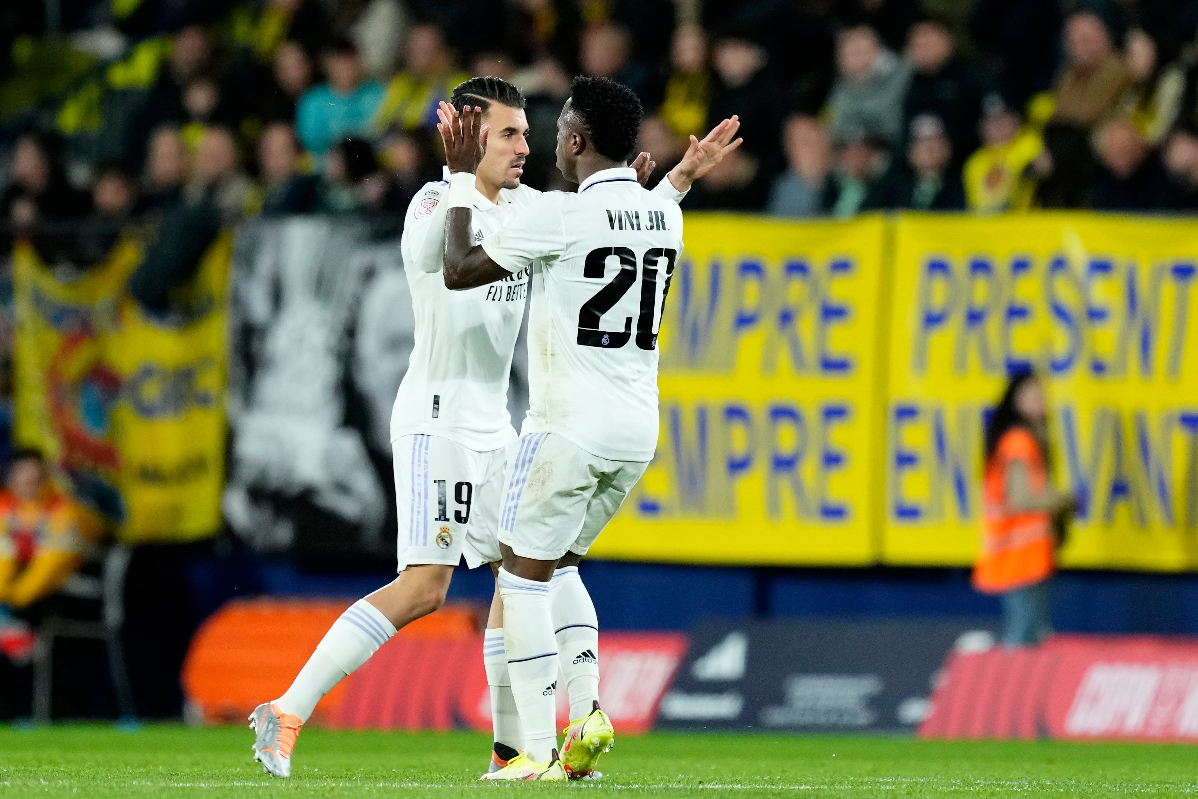 Real Madrid's Vinicius Junior celebrates with Dani Ceballos, left, after scoring his side's first goal during the Copa del Rey round of 16 soccer match between Villarreal CF and Real Madrid at La Ceramica stadium in Villarreal, Spain, Thursday, Jan. 19, 2023. (AP Photo/Jose Breton)