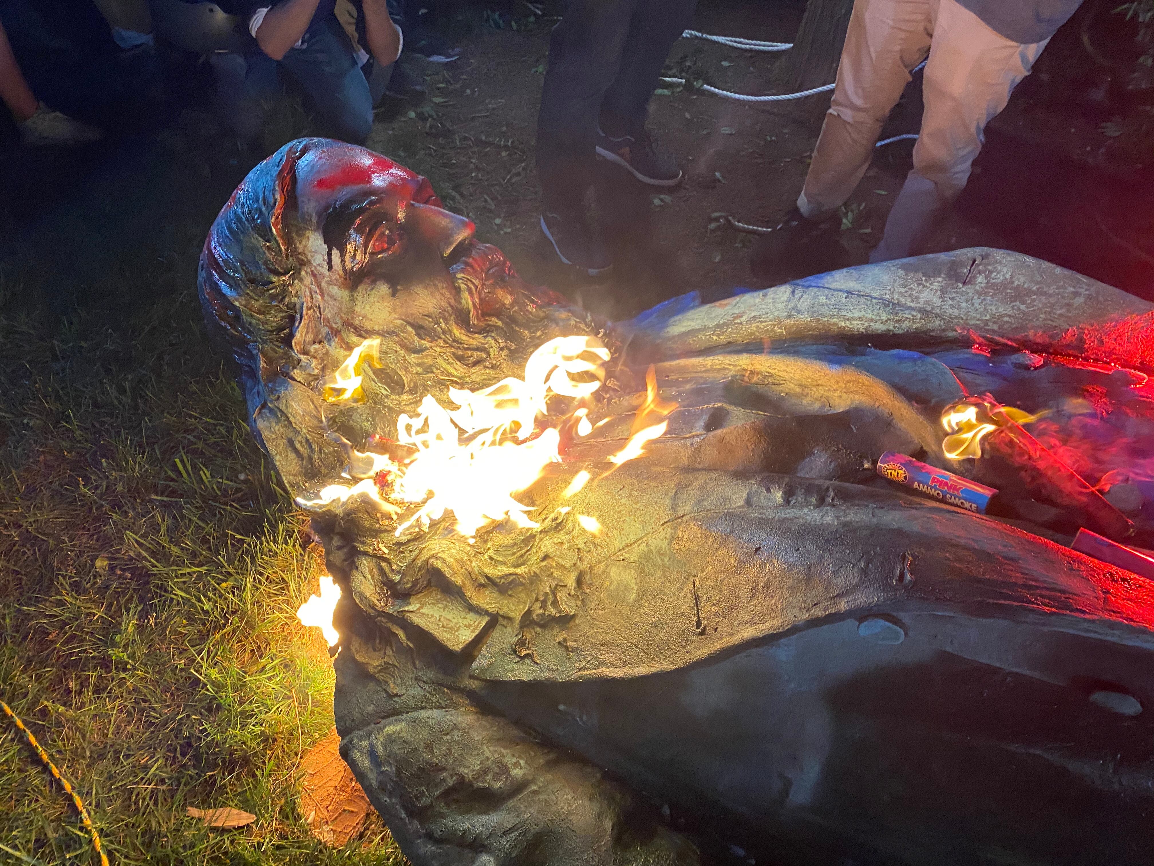 WASHINGTON, DC - JUNE 19:  Demonstrators set fire to the Albert Pike Statue after being toppled in Washington, DC on June 19, 2020.  (Photo by Evelyn Hockstein for The Washington Post via Getty Images)
