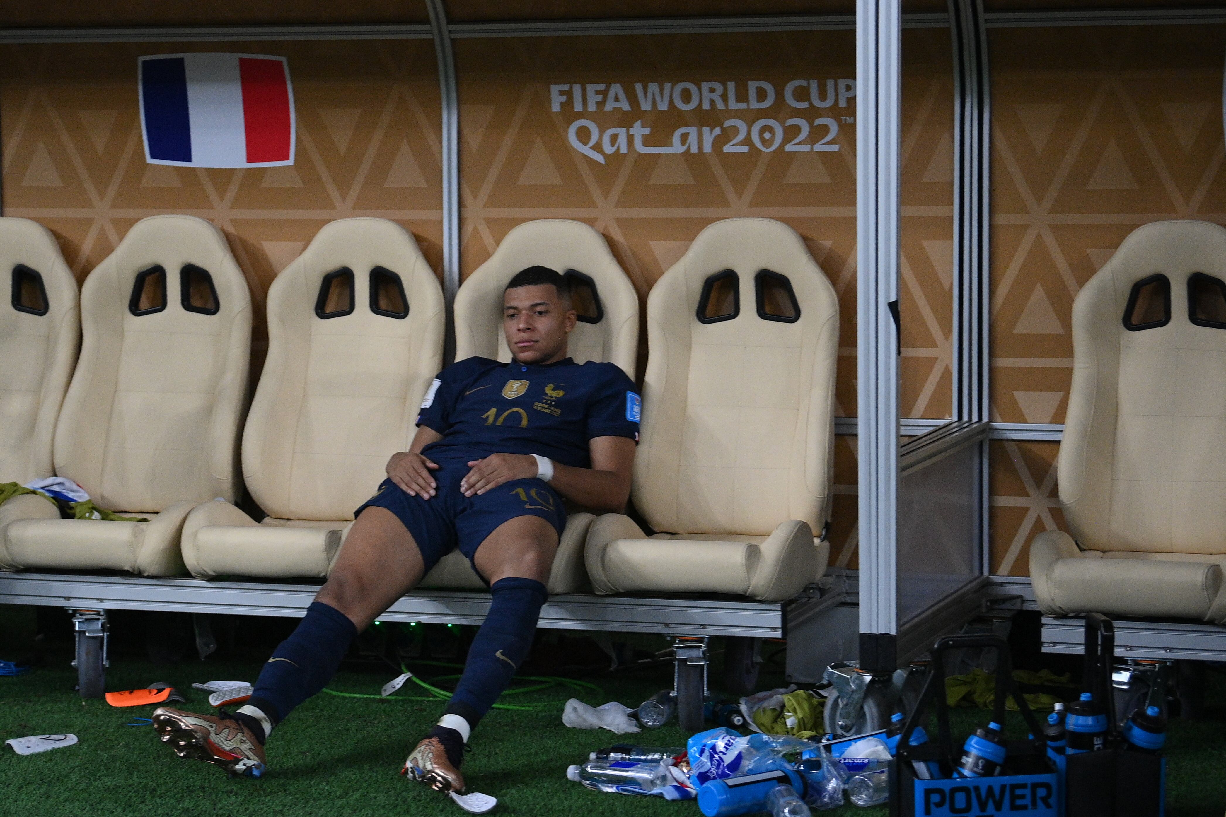 France's forward #10 Kylian Mbappe reacts after losing in the penalty shoot-out of the Qatar 2022 World Cup football final match between Argentina and France at Lusail Stadium in Lusail, north of Doha on December 18, 2022. (Photo by FRANCK FIFE / AFP)