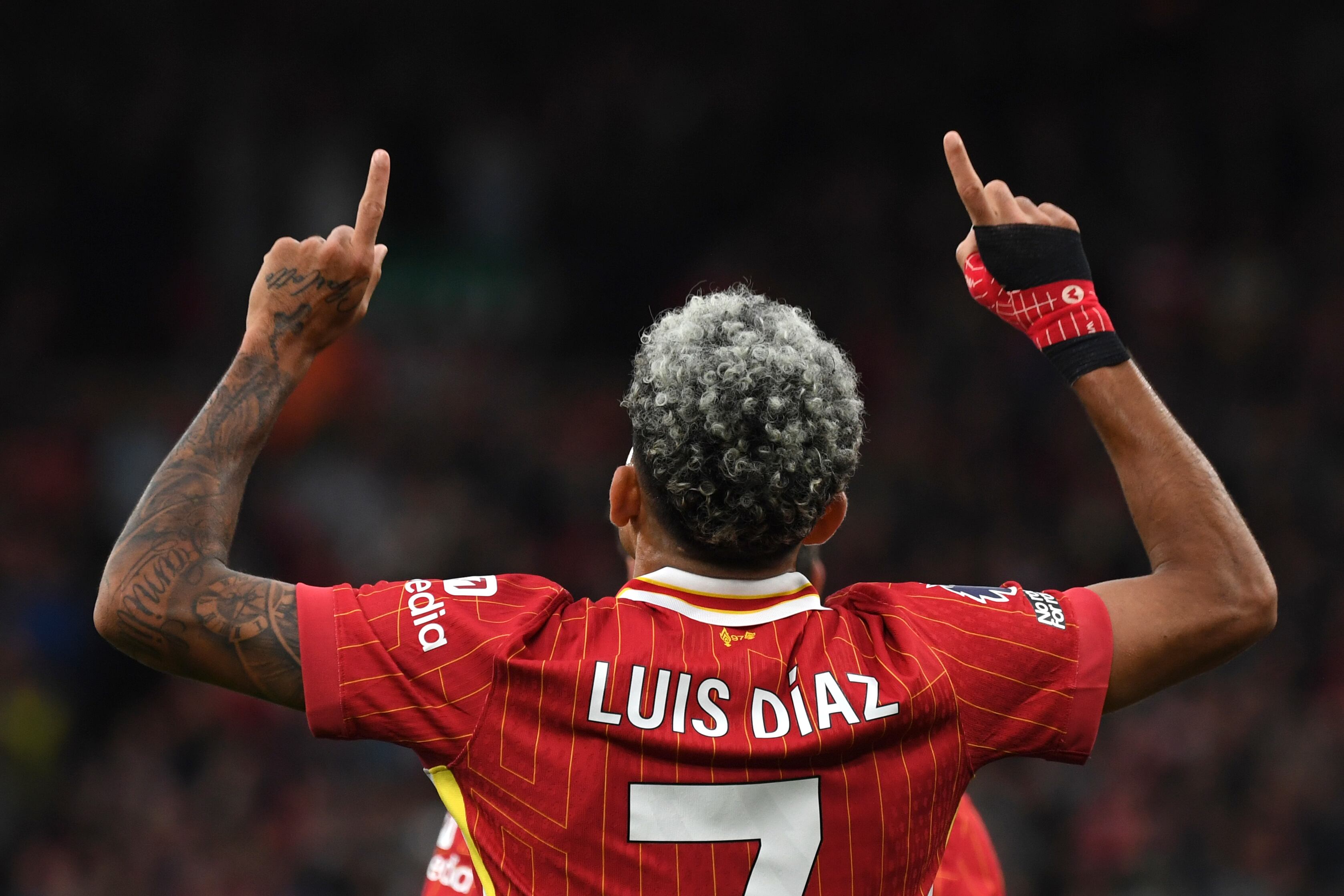 Liverpool's Luis Diaz celebrates after scoring his side's opening goal during the English Premier League soccer match between Liverpool and Brentford at Anfield Stadium, Liverpool, England, Sunday, Aug. 25, 2024. (AP Photo/Rui Vieira)