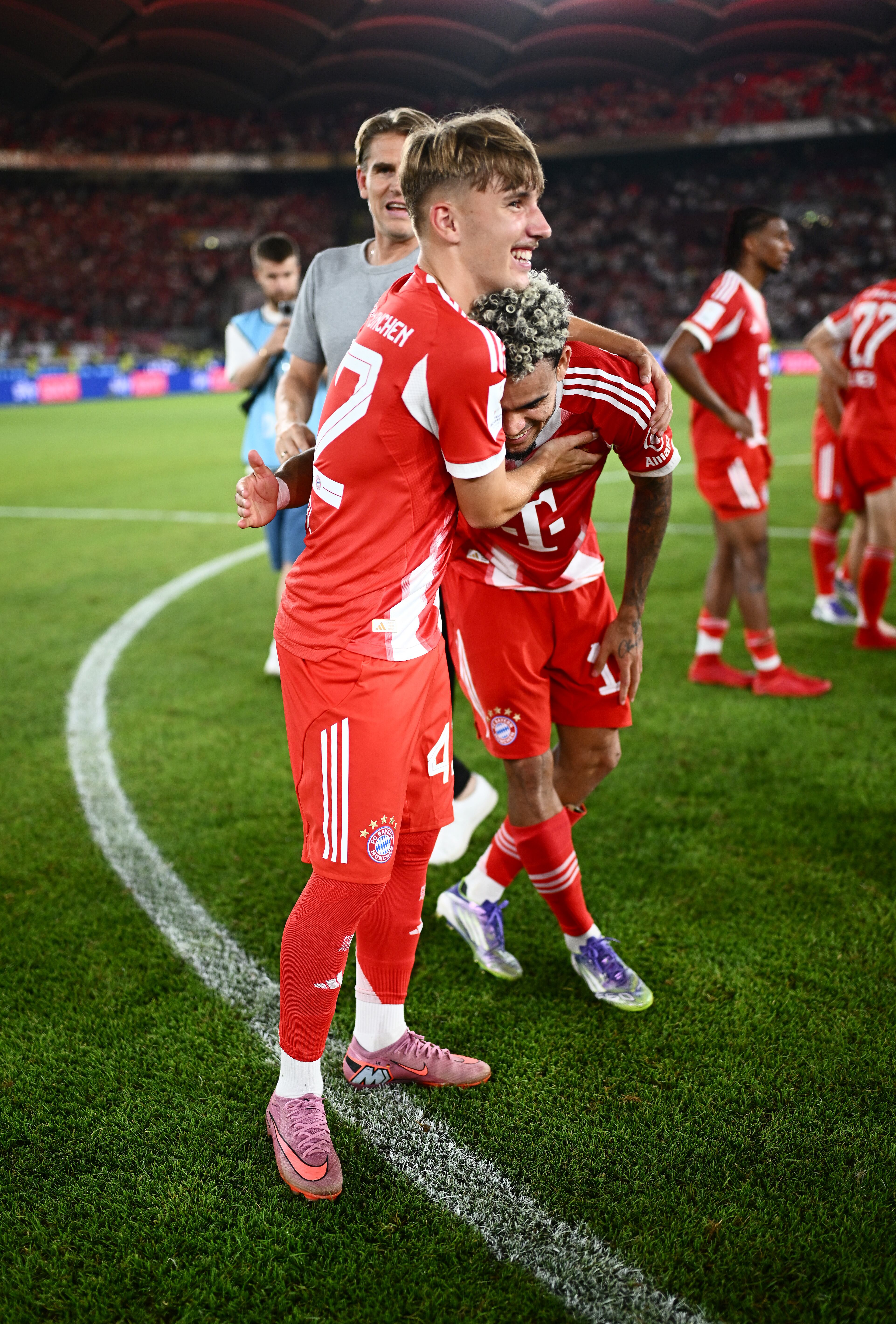 STUTTGART, GERMANY - AUGUST 16: Lennart Karl and Luis Diaz of Bayern Munich celebrate following the team's victory in the Franz-Beckenbauer-Supercup 2025 match between VfB Stuttgart and FC Bayern München at MHPArena on August 16, 2025 in Stuttgart, Germany. (Photo by S. Mellar/FC Bayern via Getty Images)