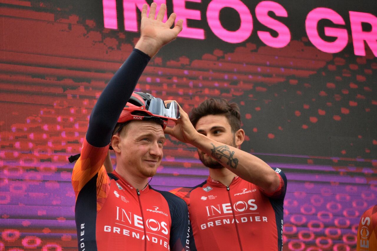 Tao Geoghegan Hart, left, with Filippo Ganna, salute fans prior to the 7th leg of the Tour of Italy cycling race, from Capua to Gran Sasso of Italy, Friday, May12, 2023. (Massimo Paolone/LaPresse via AP)