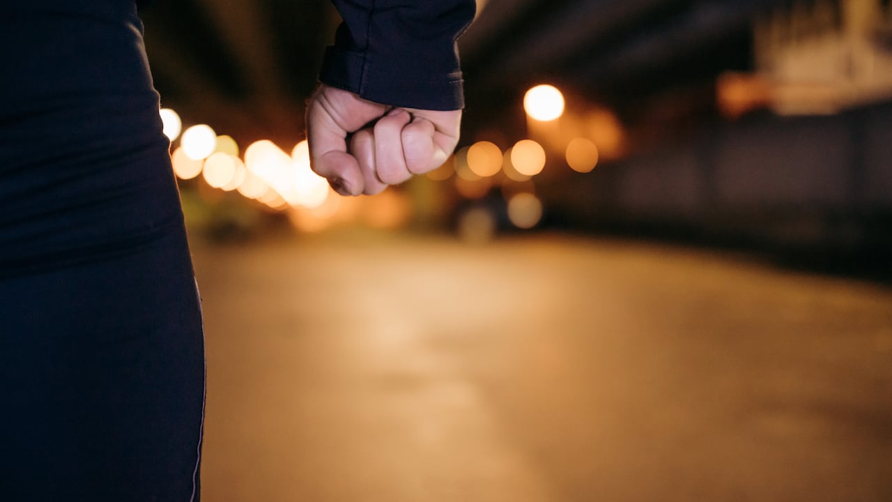 Midsection of man with clenched fist