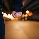 Midsection of man with clenched fist