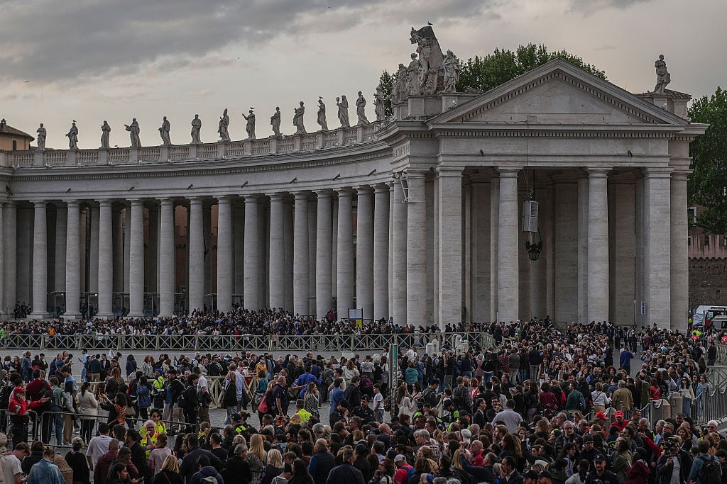 VATICAN CITY, VATICAN - APRIL 23: Faithful join a long line into St Peter's Square to view the body of Pope Francis laying in state inside St Peter's Basilica on April 23, 2025 in Vatican City, Vatican. On the third day since the death of Pope Francis was announced by the Vatican, his body is transferred from the Chapel of Santa Marta to the Basilica St Peter. He will lie in state in a simple wooden coffin until his funeral, which will be held on Saturday, 26th April 2025. (Photo by Christopher Furlong/Getty Images)