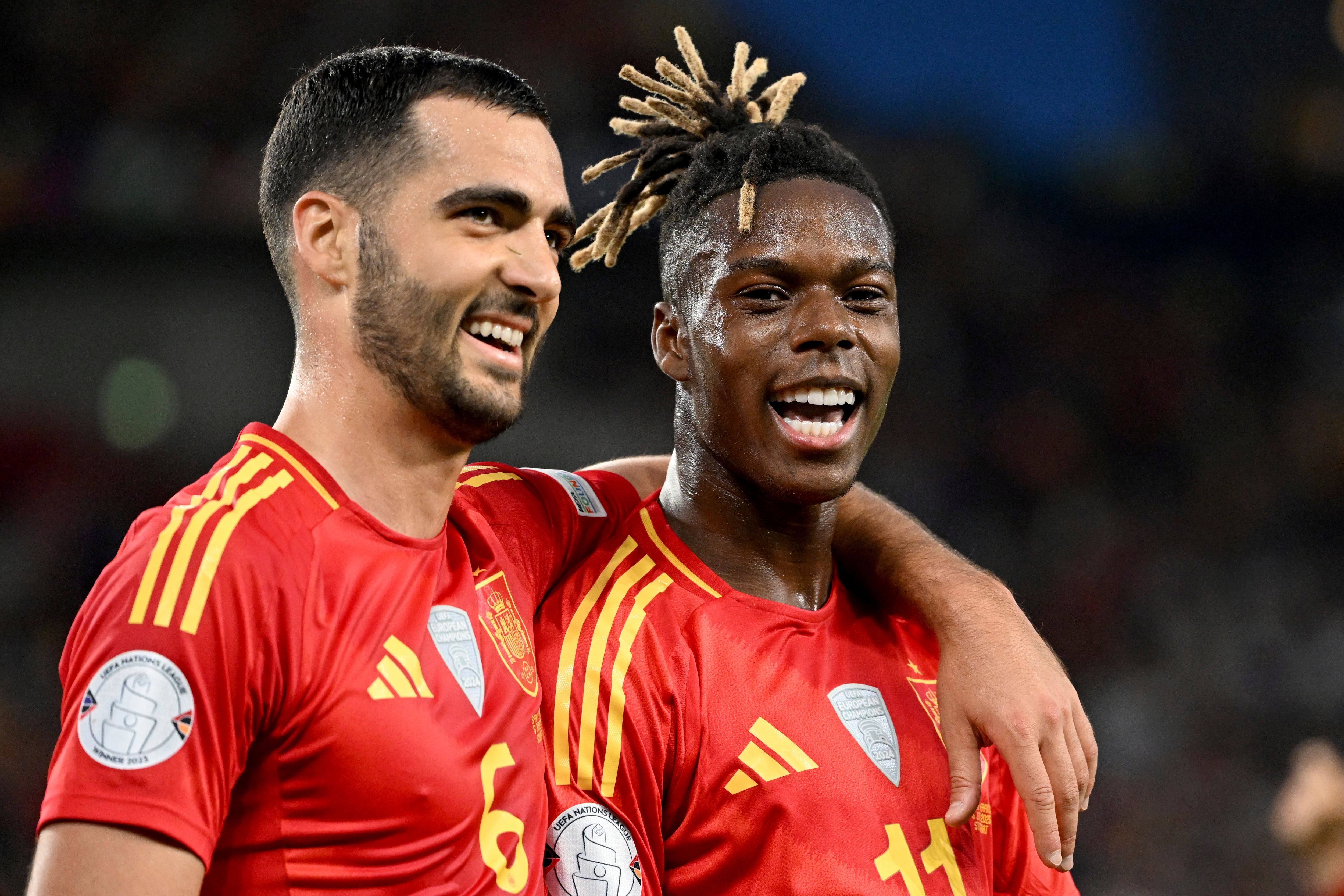 Spain's scorer Nico Williams, right, and and his teammate Mikel Merino, left, celebrate the opening goal during the Nations League semifinal soccer match between Spain and France in Stuttgart, Germany, Thursday, June 5, 2025. (Marijan Murat//dpa via AP)