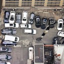 Cars are seen at the partial collapse of a parking garage in the Financial District of New York, Wednesday, April 19, 2023, in New York. The parking garage collapsed Tuesday in lower Manhattan’s Financial District, killing one worker, injuring five and crushing cars as concrete floors fell on top of each other like a stack of pancakes, officials said. (Tom Kaminski/WCBS 880 News via AP)
