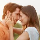 Loving young couple embracing in park
