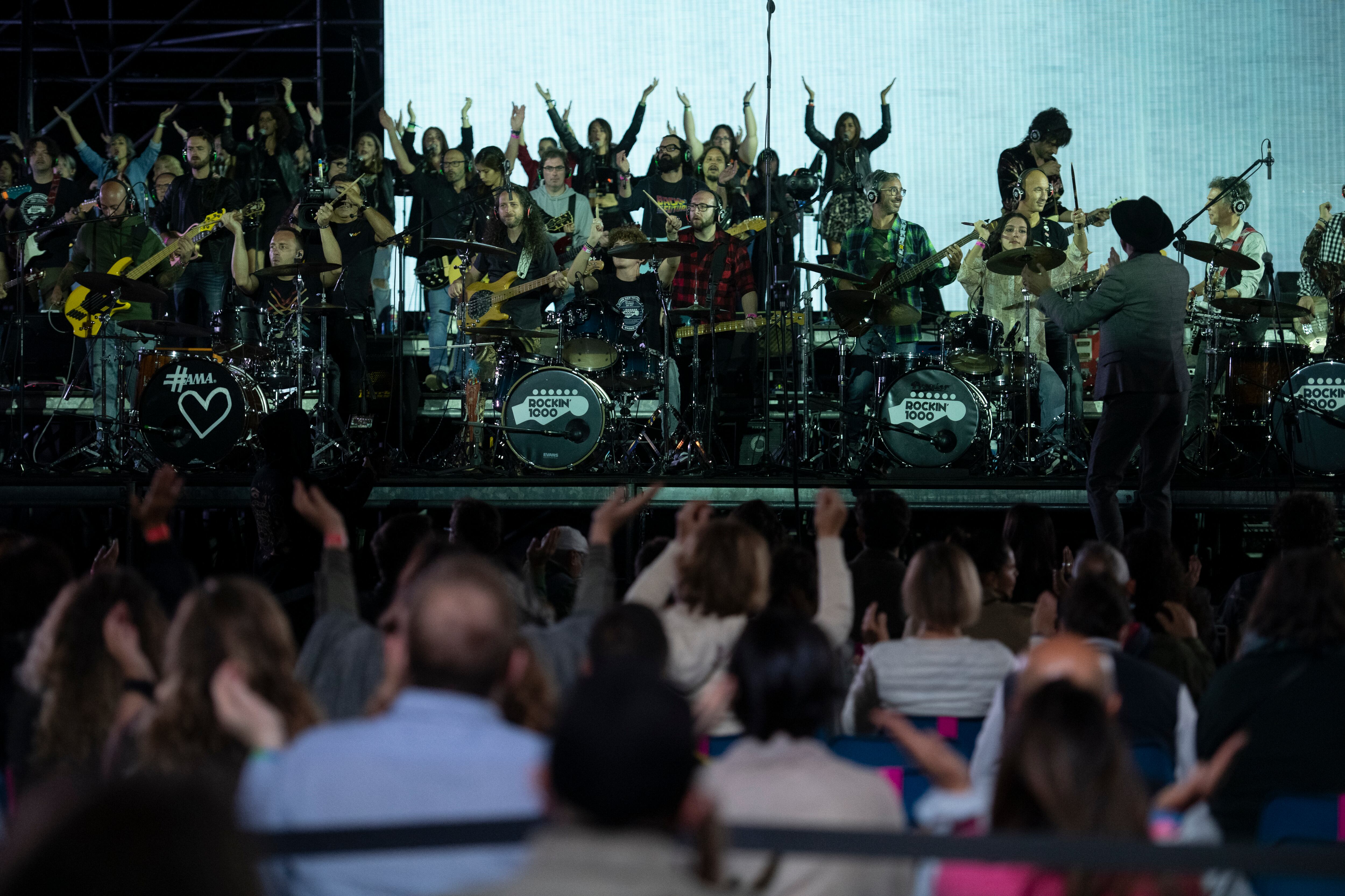 MILAN, ITALY - SEPTEMBER 30: The musicians of Rockin'1000 perform live on September 30, 2021 in Milan, Italy. A free Music4Climate concert took place at the culmination of the pre-COP26 climate change summit in Milan. Some 400 young activists from 180 countries met for thematic working groups before addressing and debating with ministers attending the UN climate change conference COP26 in Glasgow this November. (Photo by Stefano Guidi/Getty Images)