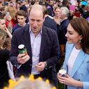 WINDSOR, ENGLAND - MAY 07: Prince William, Prince of Wales holds a can of 'Return of the King' Coronation Ale as he stands next to Catherine, Princess of Wales as they speak to people during a walkabout meeting members of the public on the Long Walk near Windsor Castle, where the Coronation Concert to celebrate the coronation of King Charles III and Queen Camilla is being held this evening on May 7, 2023 in Windsor, England. The Coronation of Charles III and his wife, Camilla, as King and Queen of the United Kingdom of Great Britain and Northern Ireland, and the other Commonwealth realms took place yesterday at Westminster Abbey today. Charles acceded to the throne on 8 September 2022, upon the death of his mother, Elizabeth II. (Photo by Andrew Matthews-WPA Pool/Getty Images)