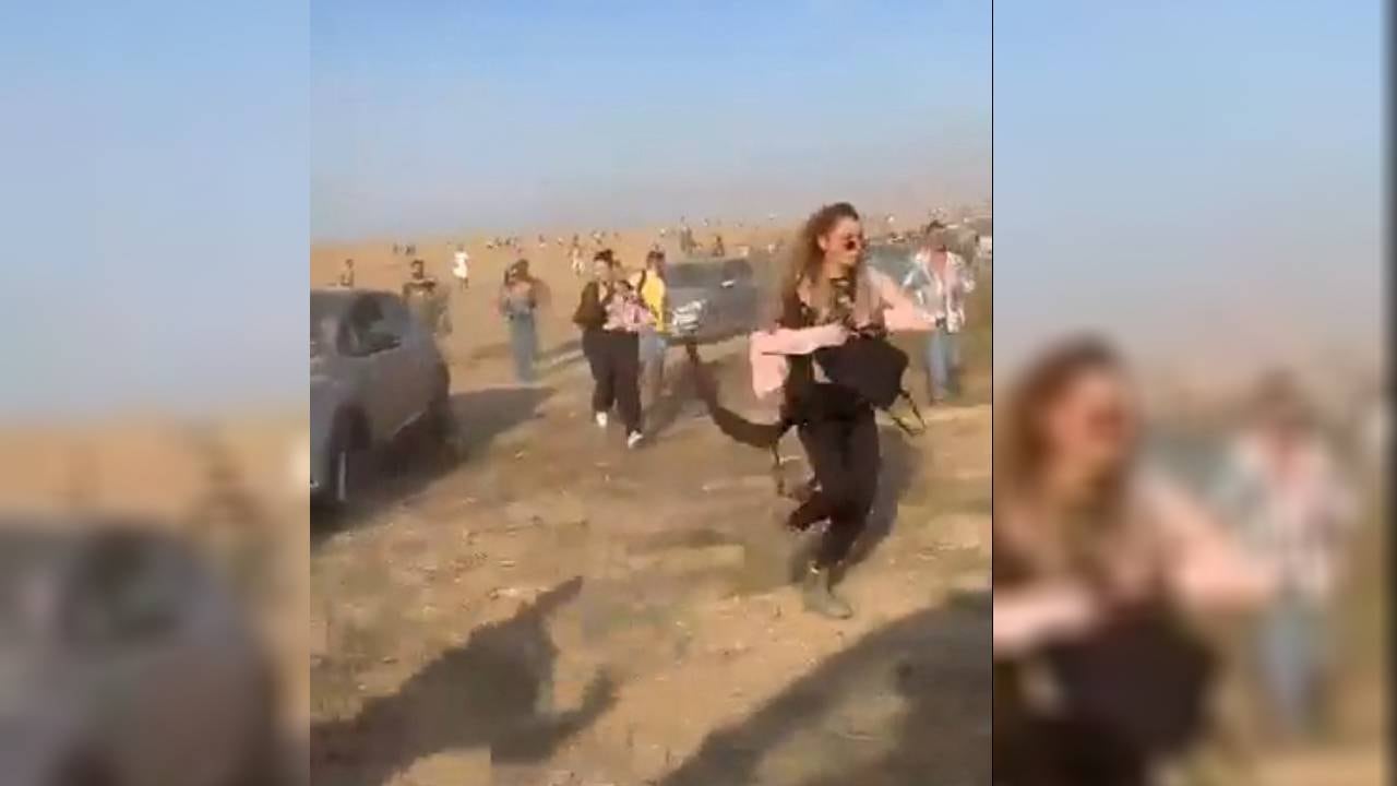 La gente en una fiesta huye durante un ataque sorpresivo lanzado por Hamás.