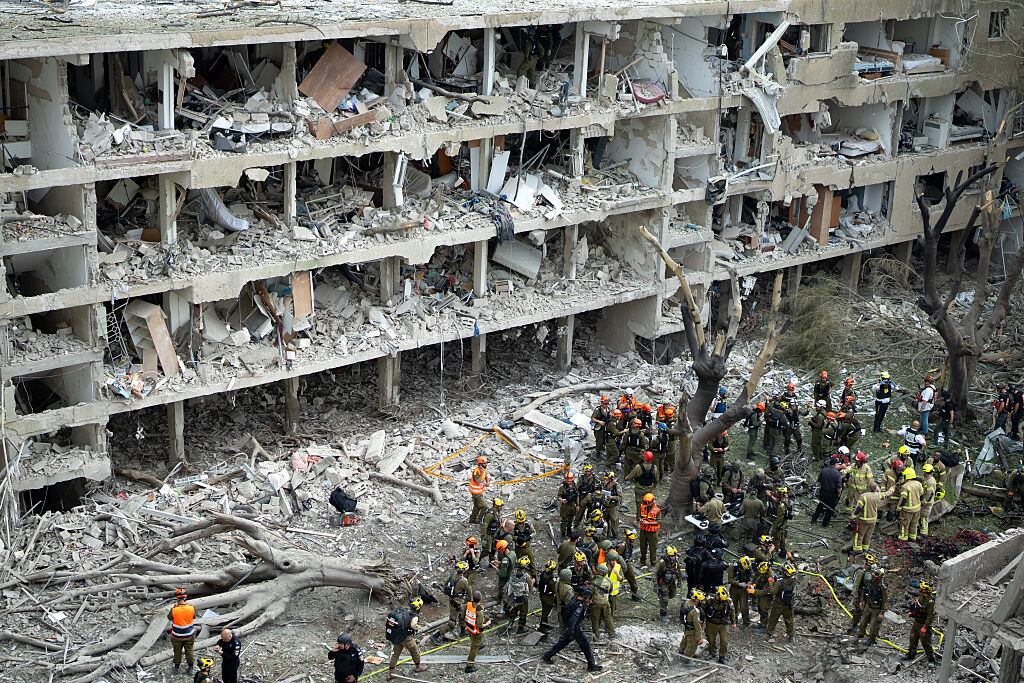 TEL AVIV, ISRAEL - JUNE 22: Emergency workers respond to the site of a missile strike in the Ramat Aviv neighborhood of Tel Aviv on June 22, 2025 in Tel Aviv, Israel. Israel was hit with a fresh wave of aerial attacks by Iran after the US entered the war overnight and bombed several Iranian nuclear sites. (Photo by Erik Marmor/Getty Images)
