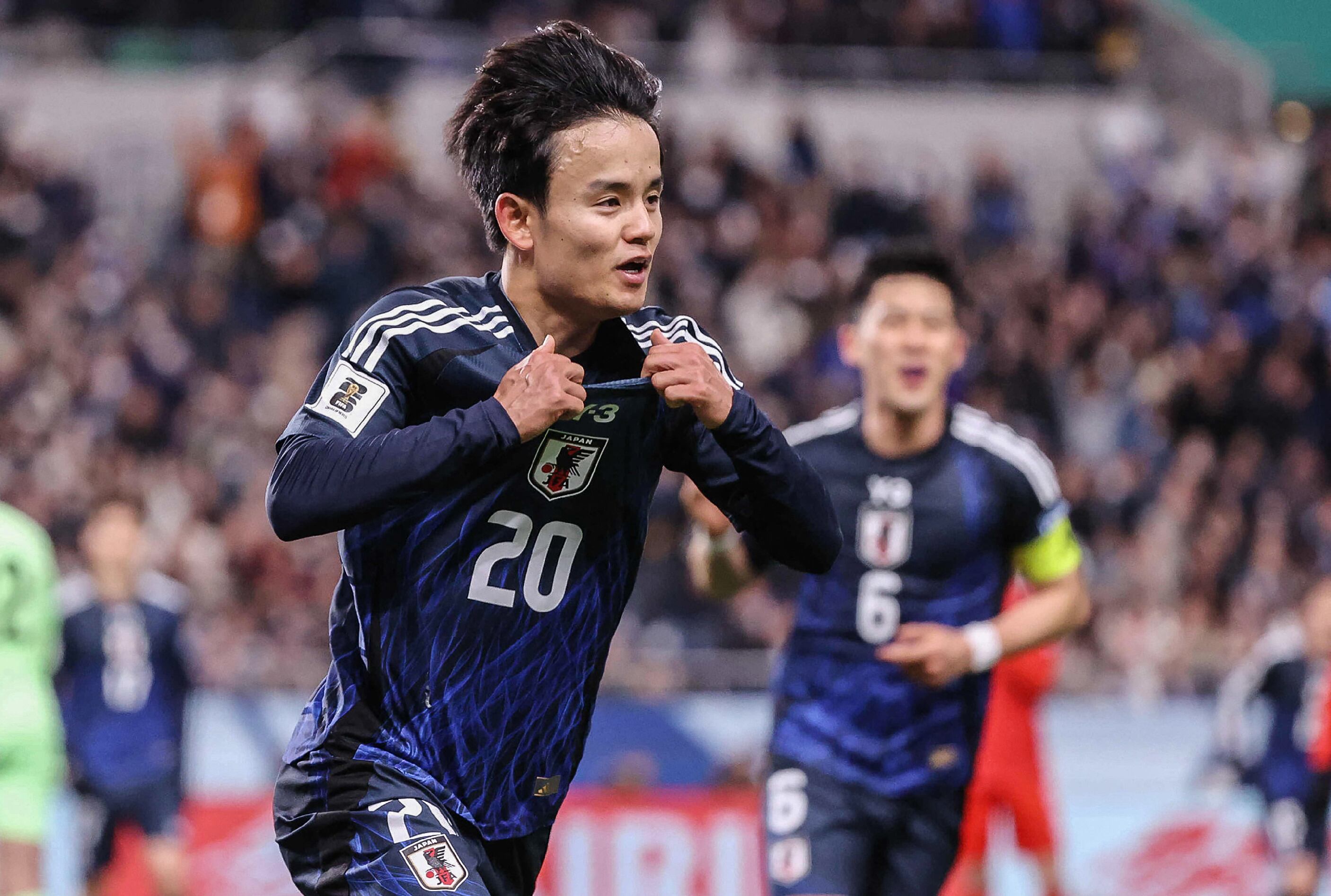 Japan's Takefusa Kubo celebrates his goal during the 2026 FIFA World Cup Asian qualification football match between Japan and Bahrain in Saitama on March 20, 2025. (Photo by JIJI Press / AFP) / Japan OUT