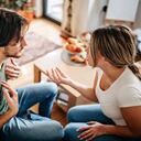 Couple have relationship issues, arguing and fighting in living room