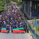 Indigenous people march in protest against a tax reform proposed by the government, in Cali, Colombia, Wednesday, May 5, 2021. Protests that began last week over a tax reform proposal continue despite President Ivan Duque's withdrawal of the tax plan on Sunday, May 2. (AP Photo/Andres Gonzalez)