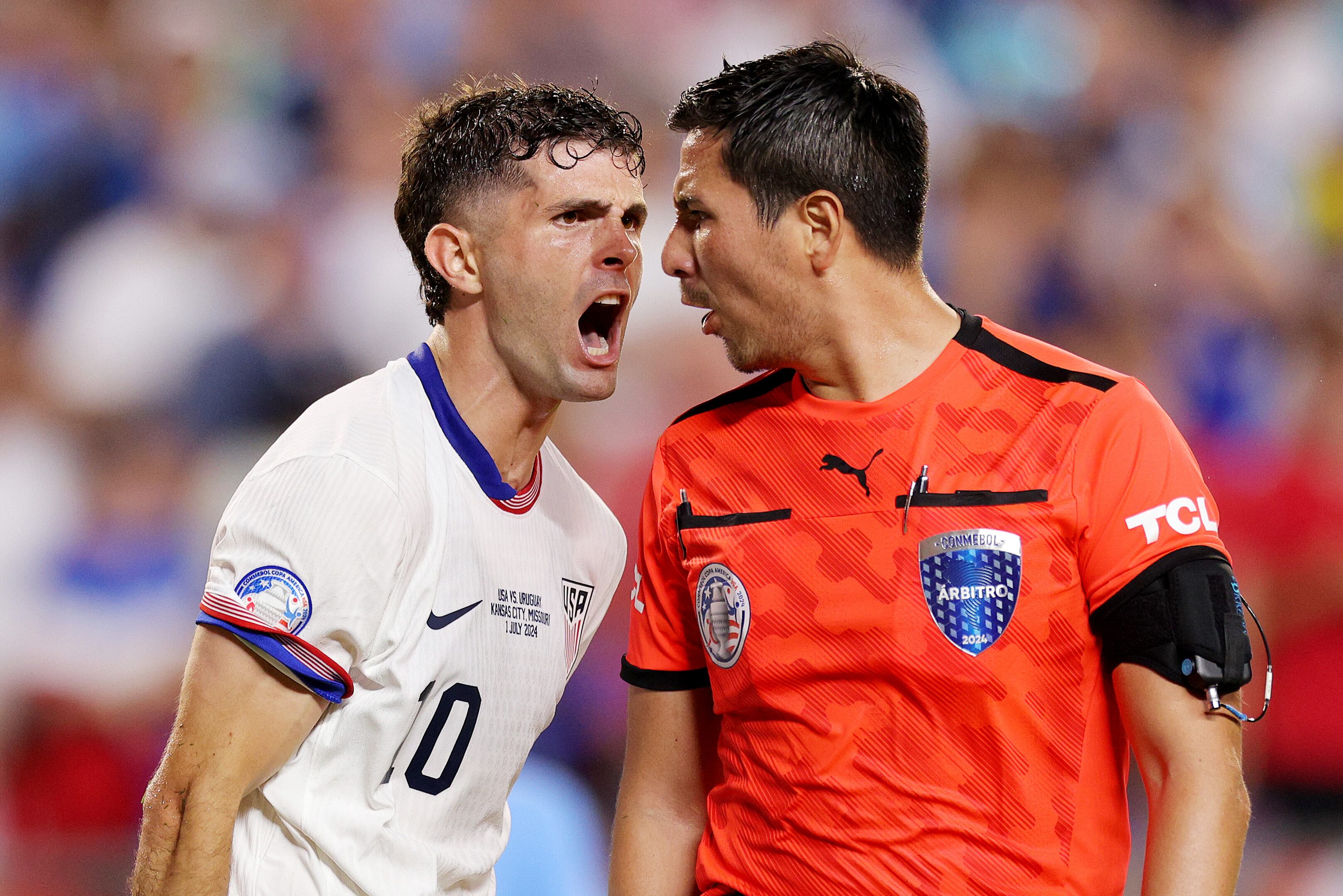 KANSAS CITY, MISSOURI - JULY 01: Christian Pulisic #10 of the United States yells at referee Kevin Ortega during the second half against Uruguay at GEHA Field at Arrowhead Stadium on July 01, 2024 in Kansas City, Missouri. (Photo by John Dorton/ISI Photos/USSF/Getty Images for USSF)