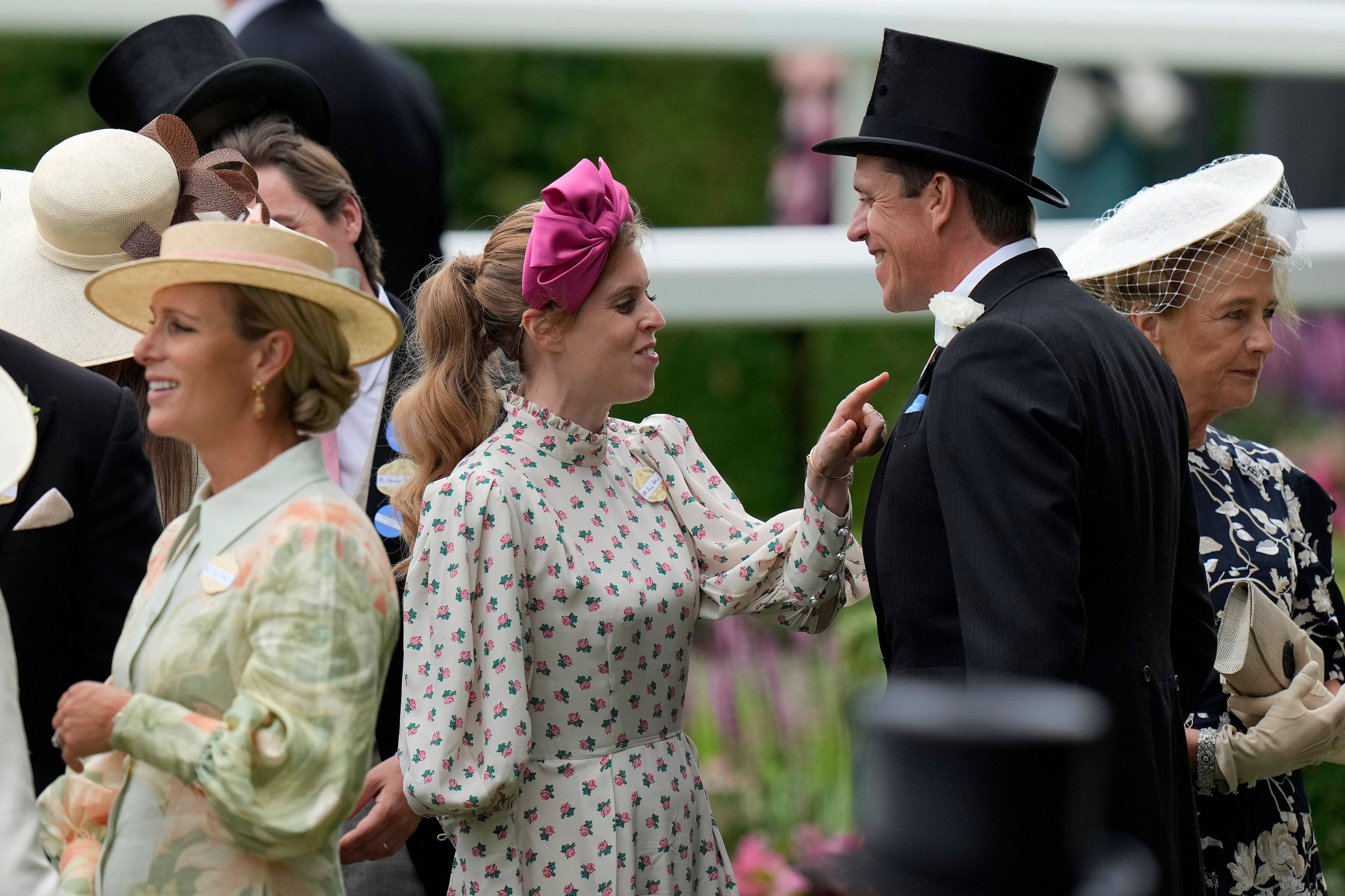 Princess Beatrice, centre, gestures as she arrives for day one of the Royal Ascot