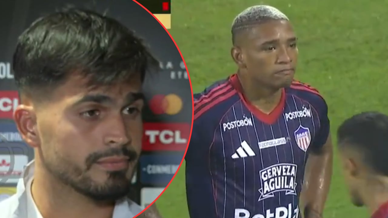 Mauro Silveira y Jermein Peña, jugadores de Junior. El uruguayo se vio molesto por la expulsión del central en Sporting Cristal.