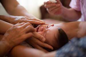 Putting Eye Drop to Baby’s Eyes for His Allergy