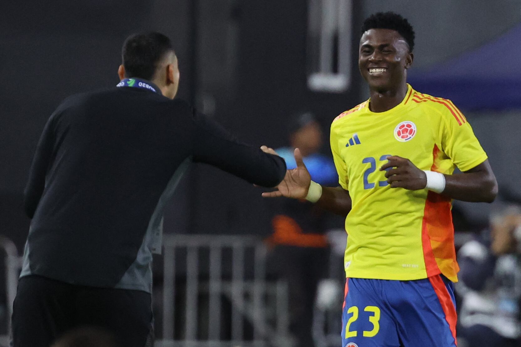 Colombia's midfielder #23 Neiser Villarreal celebrates after scoring a goal during the 2025 South American U-20 football championship final round match between Colombia and Paraguay at the Br�gido Iriarte stadium in Caracas on February 4, 2025. (Photo by Edixon GAMEZ / AFP)